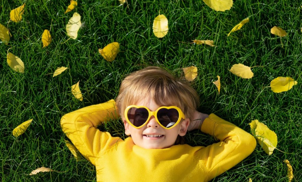happy kid yellow sunglasses